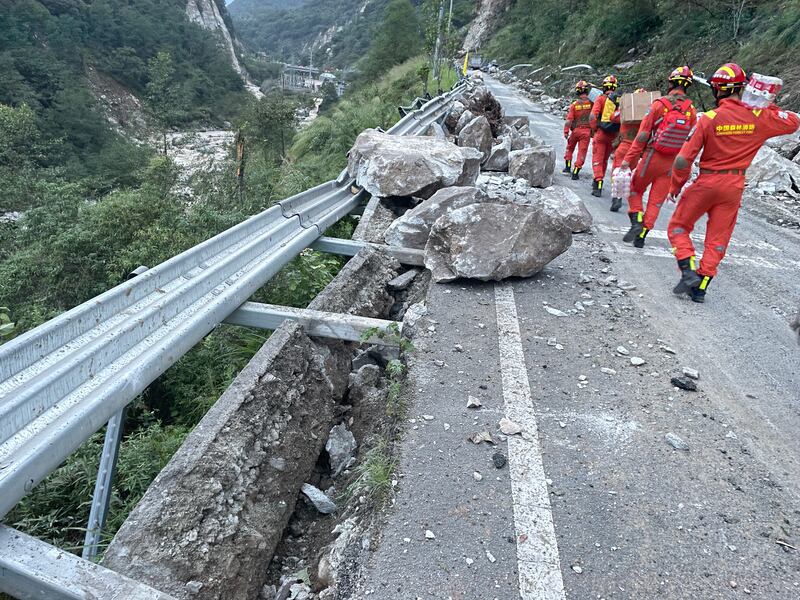 Rescuers head into Luding county after the earthquake. EPA