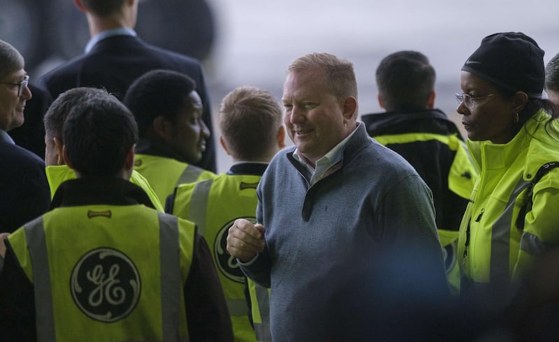 Boeing Commercial Airplanes CEO Stan Deal walks through a crowd in a hangar at Boeing Field following the first flight of the Boeing 777X airliner in Seattle, Washington. AFP