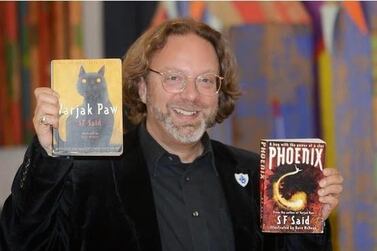 The author SF Said with his books Varjak Paw and Pheonix Courtesy SF Said