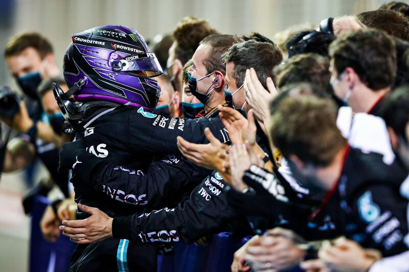 Lewis Hamilton celebrates with his Mercedes team after winning the Bahrain GP. Getty