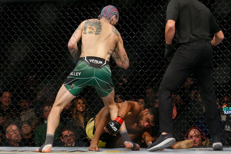 Sean O'Malley, left, defeats Raulian Paiva via TKO during a bantamweight bout at UFC 269. AP Photo
