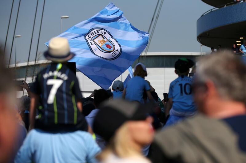 Fans arrive at the stadium prior to the Premier League match. Getty Images