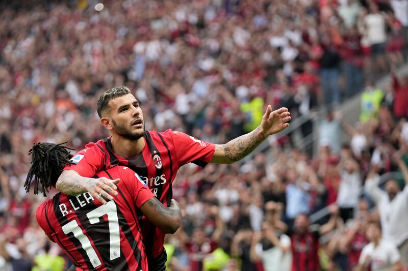 AC Milan's Theo Hernandez celebrates with Rafael Leao, left, after scoring his side's second goal against Atalanta at the San Siro. AP Photo