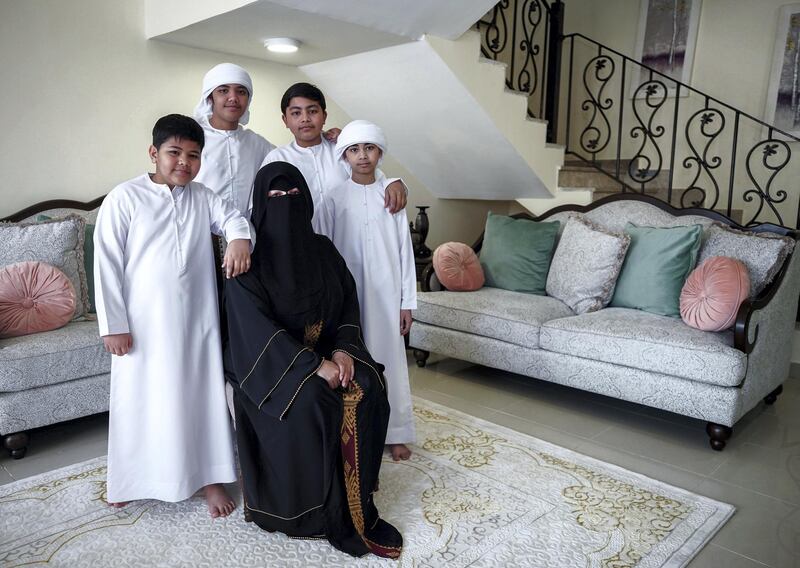 Abu Dhabi, United Arab Emirates, April 30, 2020.   
 Filipino woman, Mona Mohamed Baraguir who donates rice, eggs, cooking oil and other daily essentials to laid off workers.
Mona with her children, (L-R) Fares-9, Hamed Khalifa-15,  Ali-13 and Saed- 11. Victor Besa / The National
Section:  NA
Reporter:  Shireena Al Nuwais