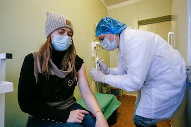 A young woman receives the Sputnik V Covid-19 vaccine in the pro-Russian militant-controlled territory of Ukraine. EPA