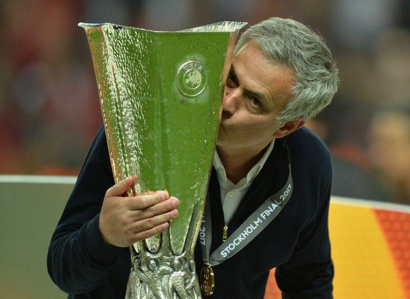 Manchester United manager Jose Mourinho celebrates with the Europa League trophy. Peter Powell / EPA