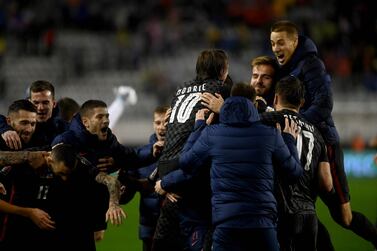Croatia's players  celebrate their victory at the end of the FIFA World Cup 2022 qualification football match between Croatia and Russia at the Poljud Stadium in Split on November 14, 2021.  (Photo by Denis LOVROVIC  /  AFP)