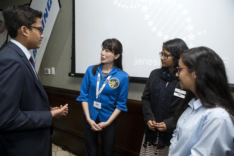 Yamazaki Naoko speaks with the finalists during the final presentations for the Genes in Space competition in Abu Dhabi. Christopher Pike / The National