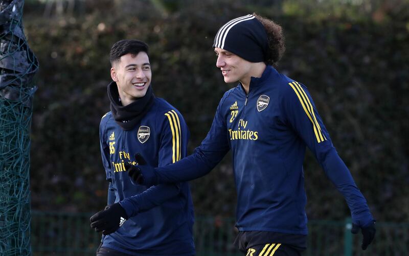 Gabriel Martinelli (left) and David Luiz during the training session at London Colney. PA