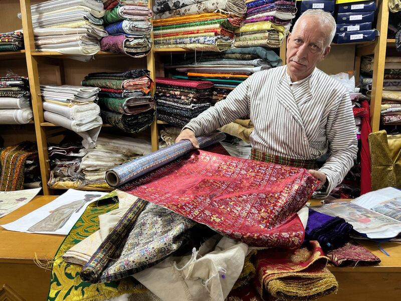 Bilal Abu Khalaf provides material for Christian, Muslim and Jewish ceremonies from his shop in occupied East Jerusalem's Old City. Thomas Helm / The National