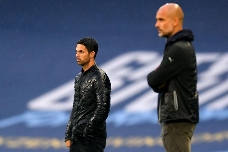 Arsenal's Spanish head coach Mikel Arteta (L) and Manchester City's Spanish manager Pep Guardiola. AFP