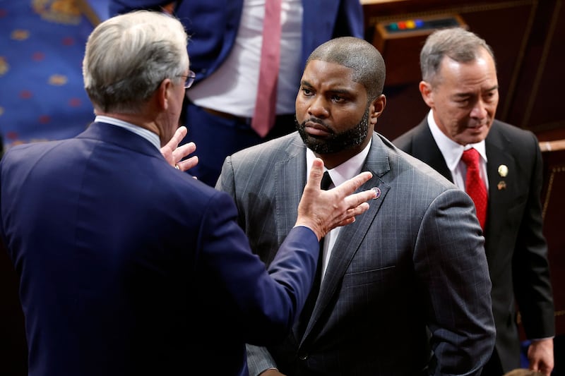 Byron Donalds, centre, a Republican, flipped his vote after Mr McCarthy failed to secure the speaker position in the first two rounds of voting. AFP