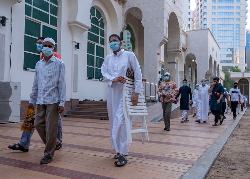 People leave Sheikh Hazza Bin Sultan Mosque after Eid prayers.