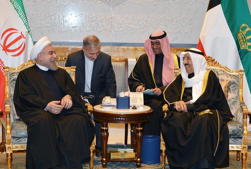 The emir of Kuwait, Sheikh Sabah Al Sabah, wight, with Iranian president Hassan Rouhani in Kuwait City. Kuwait Emiri Diwan / AFP
