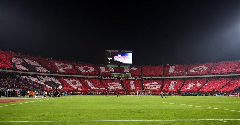 Fans of Egypt's Al Ahly display a message which reads "for fun" ahead of the CAF Confederation Cup final second leg match on Saturday in Cairo. Mohamed El Shahed / AFP