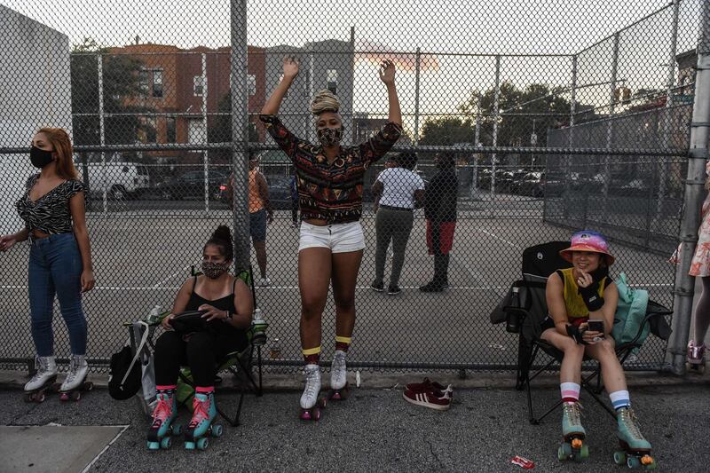 A person poses for a portrait before participating in a "pop-up" roller skating session hosted by the Butter Roll skating club in the Brooklyn borough of New York City. AFP