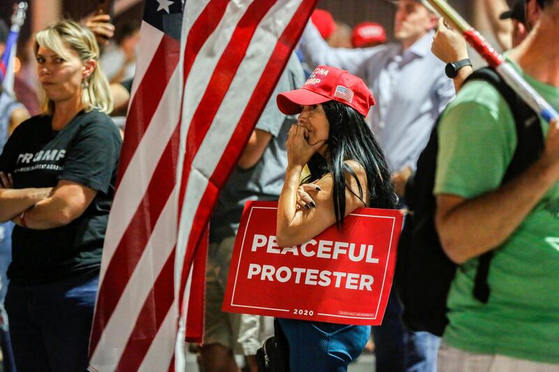 Supporters of President Donald Trump gather during a protest  in front of the Maricopa County election centre  in Phoenix, Arizona. Reuters