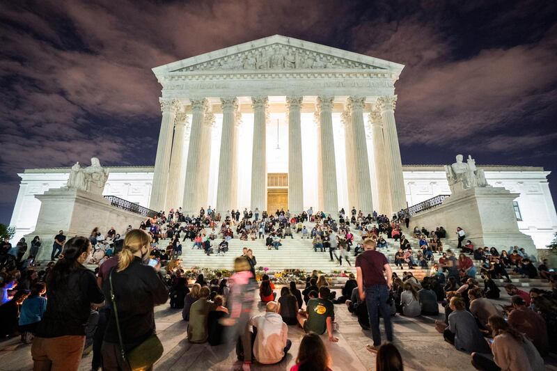 Mourners gather on the steps of the US Supreme Court in Washington DC after Justice Ruth Bader Ginsburg died from pancreatic cancer at the age of 87, on September 18, 2020. EPA