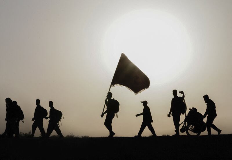 Iraqi and Iranian Shiite pilgrims walk from Najaf to Karbala to take part in the Arbaeen religious festival. AFP