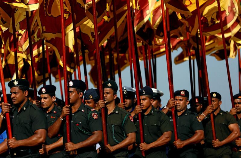 Sri Lanka's Army soldiers march with the national flags at the parade during a rehearsal for Sri Lanka's 70th independence day celebrations in Colombo, Sri Lanka on February 1, 2018. Dinuka Liyanawatte / Reuters