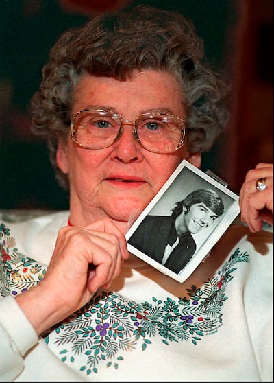 Louise Clinkscales holds a photo of her son Kyle Clinkscales at age 21 in this undated file photo. AP