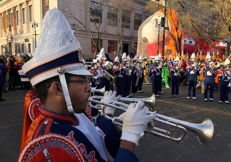 James Leach plays the trumpet as participants in the Macy's Thanksgiving Day Parade assemble before the start of the parade  in New York. AP