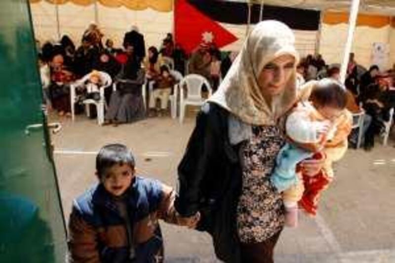 Mohammad Abdullah, left, (5), is leaded by his mother Raeda Momani to be scanned by doctors of the Operation Smile in Sahab, Jordan March 06, 2009. Mohammad had his cleft lip repaired last year by Operation Smile

Salah Malkawi for The National *** Local Caption ***  SM007_Cleft.jpg