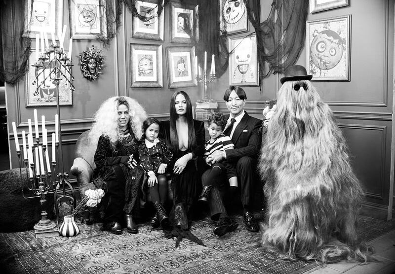 Chrissy Teigen and her family as The Addams Family
