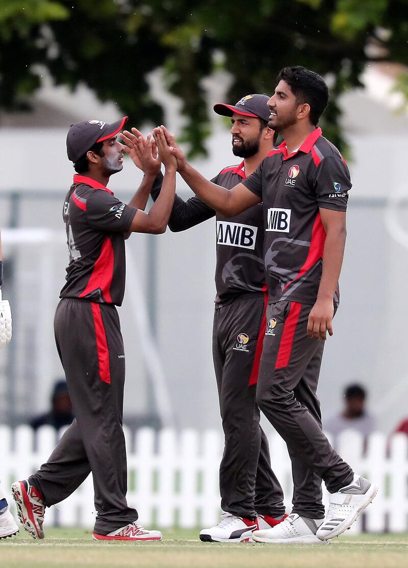 DUBAI, UNITED ARAB EMIRATES , Dec 15– 2019 :- Junaid Siddique (right) of UAE celebrating after taking the wicket of Josh Davey during the World Cup League 2 cricket match between UAE vs Scotland held at ICC academy in Dubai. He took 3 wicket in this match. ( Pawan Singh / The National )  For Sports. Story by Paul