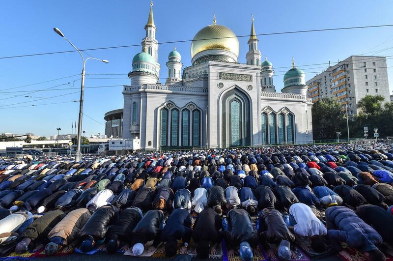 Members of Russia's Muslim community pray in a street outside the Central Mosque during the Eid al-Adha (Feast of Sacrifice) celebrations in Moscow on September 1, 2017.
Muslims across the world are celebrating the annual festival of Eid al-Adha, or the Festival of Sacrifice, which follows the annual pilgrimage to Mecca. It commemorates the willingness of biblical patriarch Abraham to sacrifice his son Ishmael and during the period Muslims distribute food to the poor. / AFP PHOTO / VASILY MAXIMOV