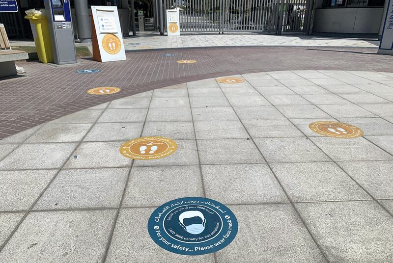 DUBAI, UNITED ARAB EMIRATES , October 10 – 2020 :- Face mask wearing sticker pasted on the floor at the entrance of the Zabeel park in Dubai. Stickers about Covid safety measures pasted all over the park for the visitors. (Pawan Singh / The National) For News/Stock/Online.