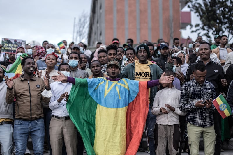 A protester draped in the Ethiopian flag in Addis Ababa.