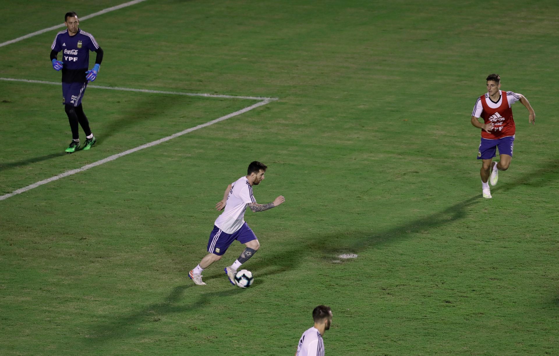 Messi makes a run with the ball during training in Salvador. AP Photo