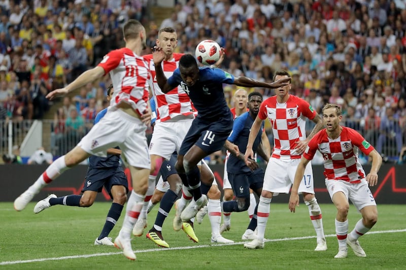 Croatia's Ivan Perisic, second left, handles the ball to give away a penalty. AP