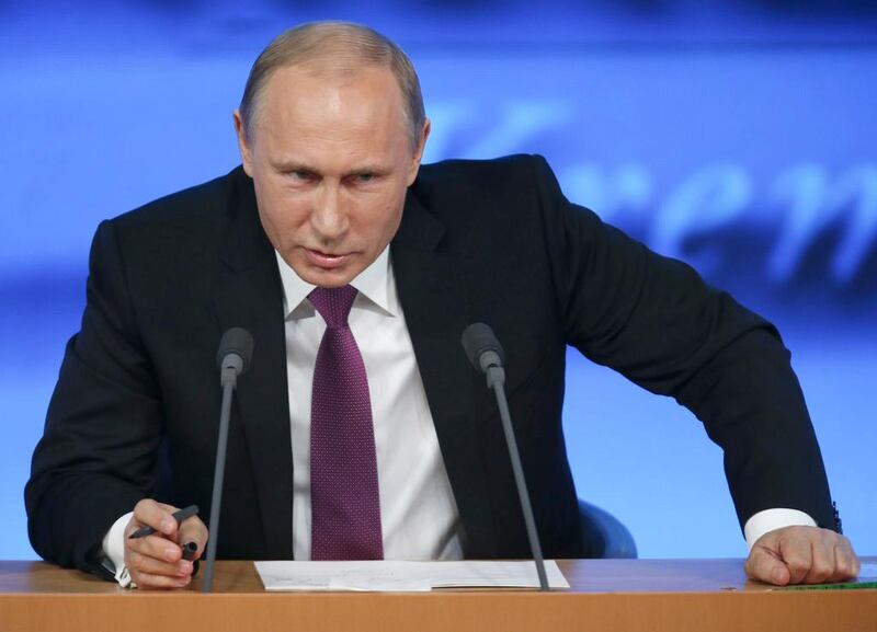 The Russian president Vladimir Putin speaks at his annual end-of-year news conference in Moscow on December 18, 2014.