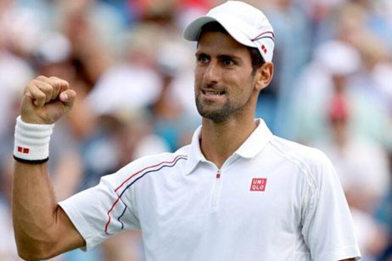 Novak Djokovic celebrates scoring a point against Juan Martin Del Potro at the Western & Southern Open semi-final