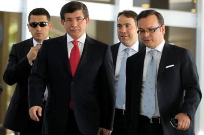 Turkish Foreign Minister Ahmet Davutoglu, centre left, leads advisors as he arrives to speak to the media in Ankara, Turkey, Friday, Sept. 2, 2011. Turkey said Friday it was expelling the Israeli ambassador and cutting military ties with Israel over the last year's deadly raid on a Gaza-bound aid flotilla.  Davutoglu said Turkey was downgrading diplomatic ties to the level of second secretary and that the ambassador and other high-level diplomats would leave the capital Ankara by Wednesday.(AP Photo) *** Local Caption ***  Turkey Israel.JPEG-03322.jpg
