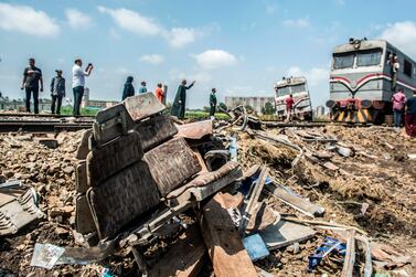 A train passes by the site of the fatal collision in Khorshid, on the outskirts of Alexandria, on August 12, 2017. Khaled Desouki / AFP