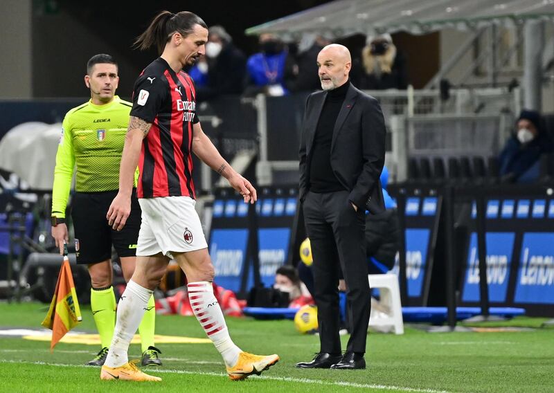 Zlatan Ibrahimovic walks past AC Milan manager after the veteran striker had been sent-off. AFP