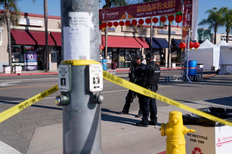 Police stand guard near the scene of the deadly shooting. Getty