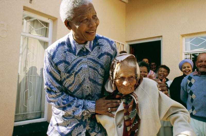 Mandela in Kliptown, Soweto, with a woman who hid him when  he was a fugitive from 1963 to 1964. 

