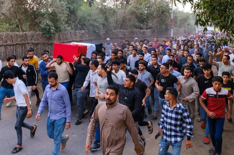 People carry the coffin of Egyptian soldier Abdullah Ramadan during a funeral in Faiyum Governorate. EPA