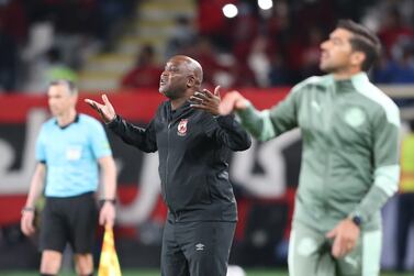 epa09738954 Pitso Mosimane (C) head coach  of Al Ahly SC reacts during the FIFA Club World Cup 2021 semi final soccer match between SE Palmeiras and AL Ahly SC in Abu Dhabi, United Arab Emirates, 08 February 2022.  EPA/ALI HAIDER