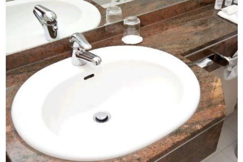 Look for sinks and pipes that are properly sealed and free from leaks. iStockphoto