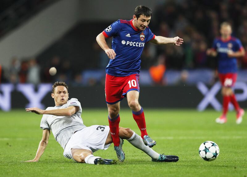 CSKA Moscow's Alan Dzagoev in action against Manchester United's Nemanja Matic. Yuri Kochetkov / EPA