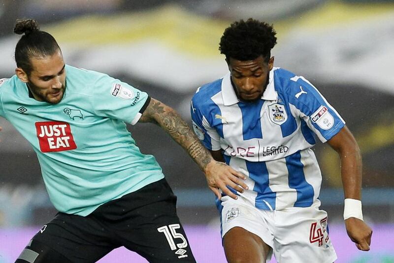 Kasey Palmer of Huddersfield Town battles Bradley Johnson of Derby County during their match last week. Andrew Boyers / Action Images