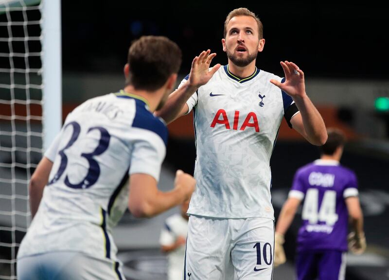 Tottenham's Harry Kane celebrates with teammate Ben Davies after opening the scoring at the Tottenham Hotspur Stadium. EPA