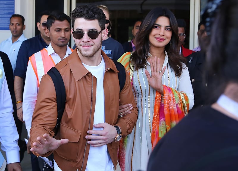 Priyanka Chopra, right, and Nick Jonas, left, arrive in Jodhpur in the western Indian state of Rajasthan. Chopra and Jonas are set to be married in a series of ceremonies in Jodhpur. Sunil Verma / AFP