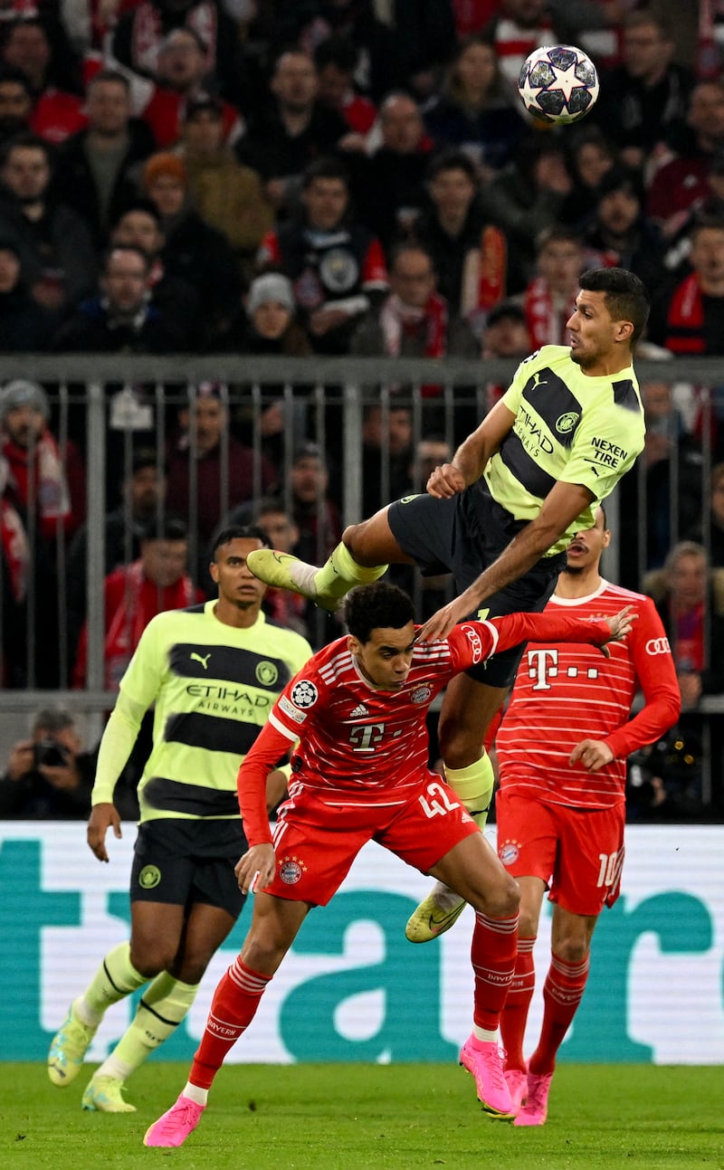 Manchester City midfielder Rodri wins an aerial duel with Bayern Munich's Jamal Musiala. AFP