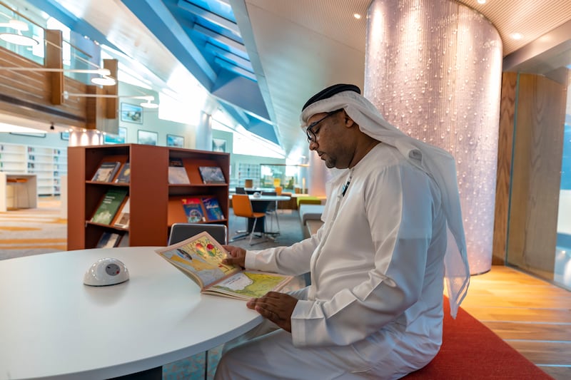 Library board director Jamal Al Shehhi inspects some of the books in stock.